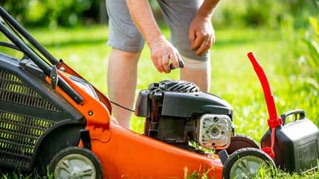 A lawn mower being used