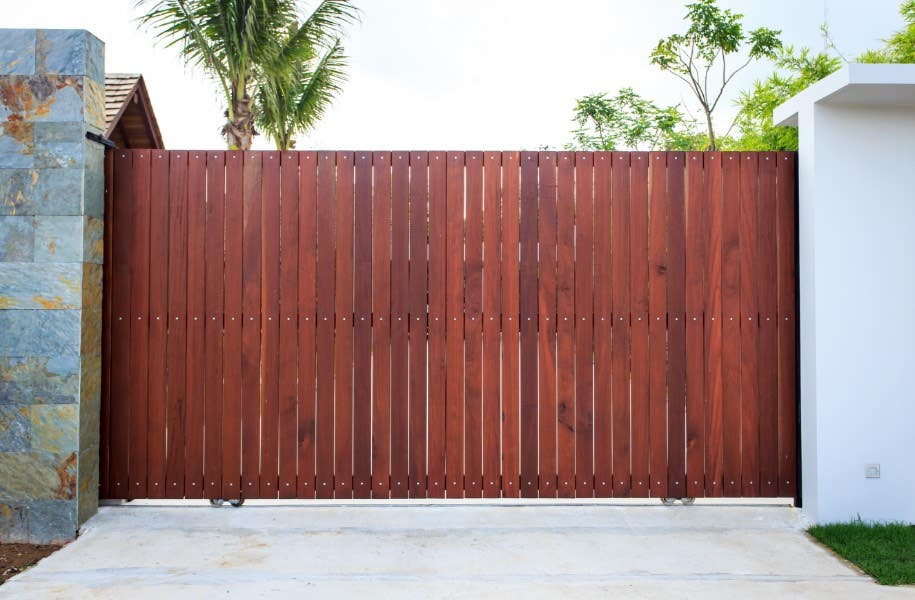 Timber gate entrance to house