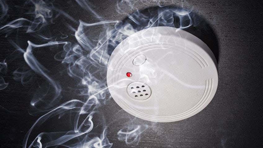  smoke rising to a smoke alarm 