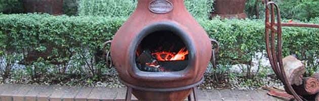 A chimenea in a backyard