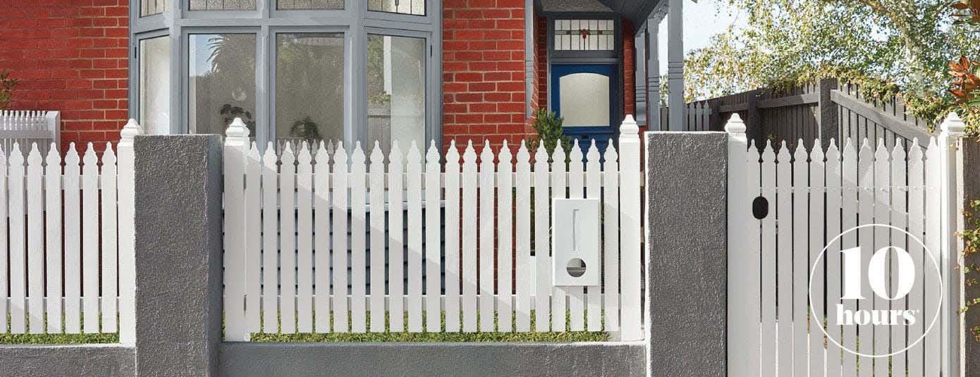  a newly painted picked fence 