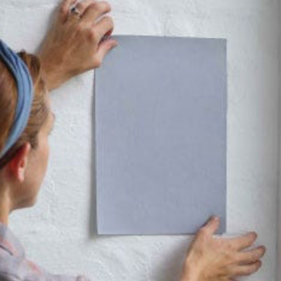 Woman using paint sample