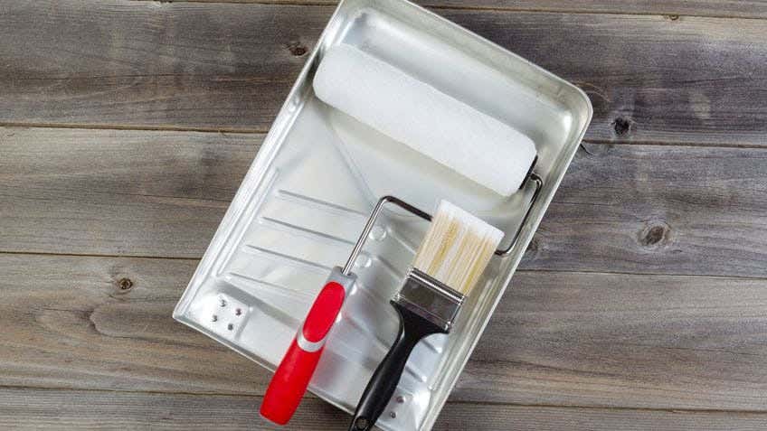  a paint roller and tray 